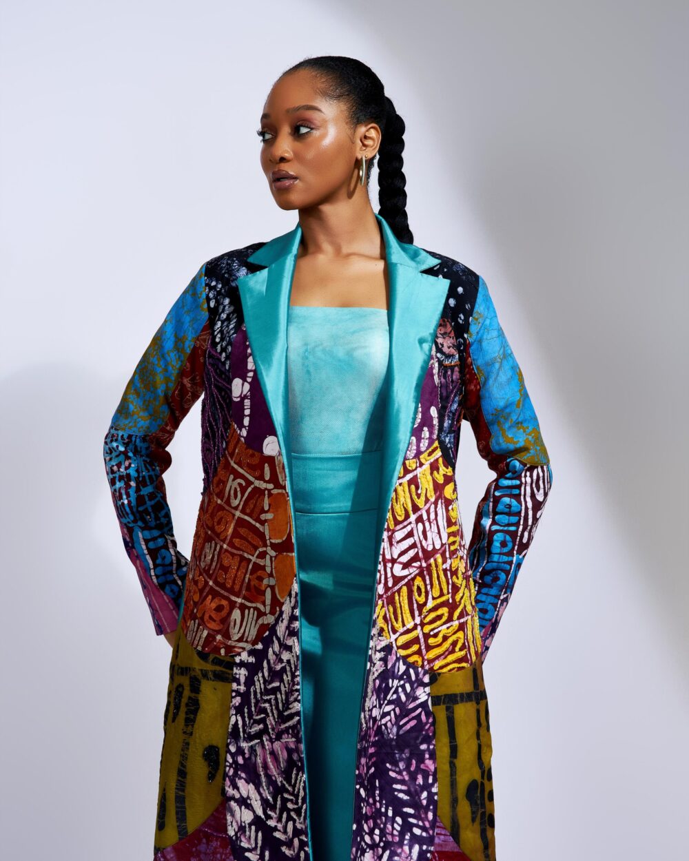 Maxi Patchwork Coat Paired With a Teal Column Skirt - Image 6